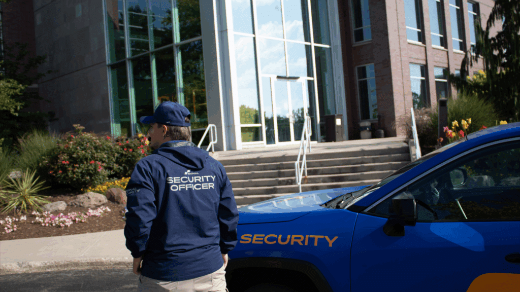 Security officer driving patrol vehicle during routine property check